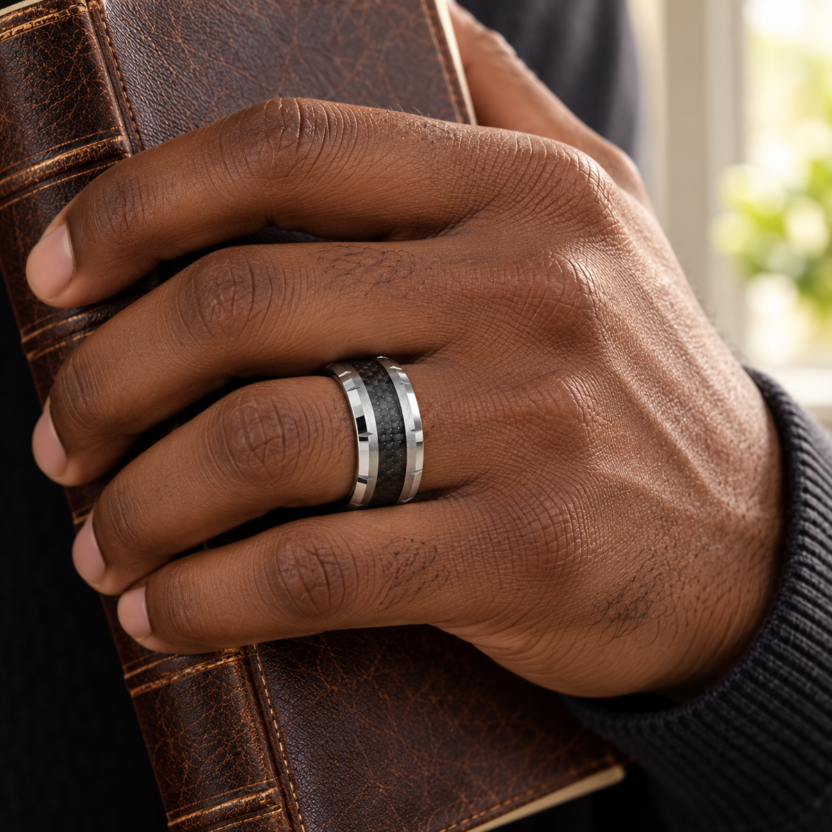 Lifestyle view of 10mm Tungsten Band with Black Carbon Fiber Inlay worn on hand