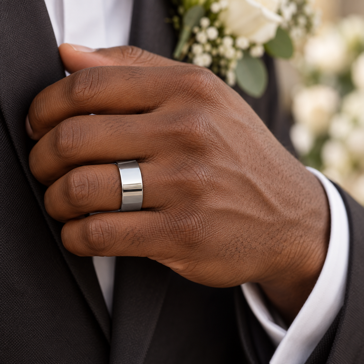 Lifestyle view of 12mm Tungsten High-Polish Flat Band worn on hand