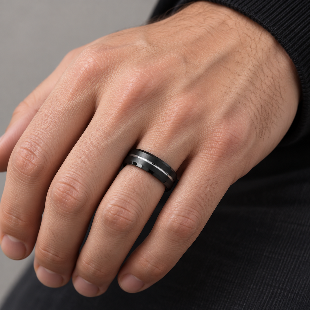 Lifestyle view of 6mm Black Tungsten Band with Gray Center Groove worn on hand