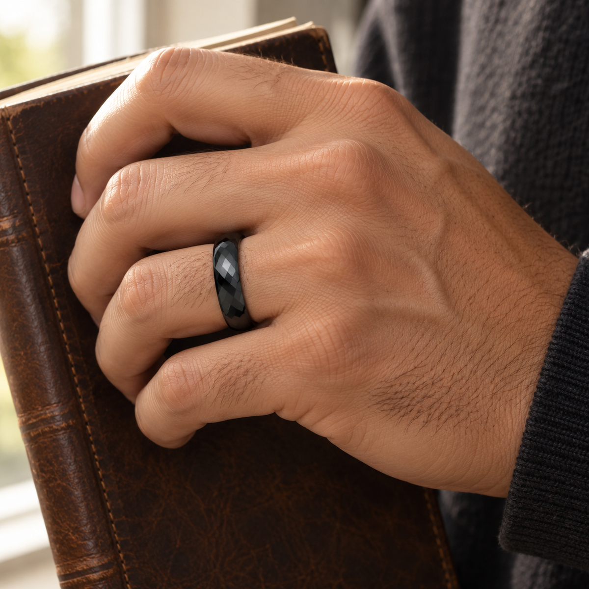 Lifestyle view of 6mm Black Tungsten High-Polish Faceted Domed Band worn on hand