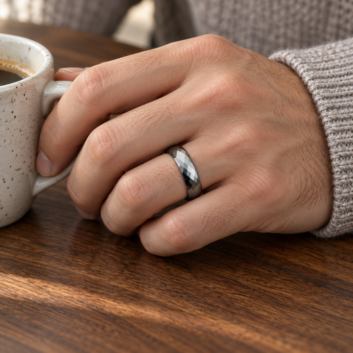 Lifestyle view of 6mm Tungsten Faceted Domed Band worn on hand