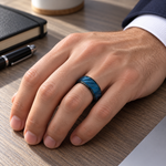 Lifestyle view of 8mm Black & Blue Tungsten Diagonal Groove Band worn on hand