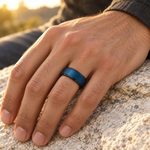 Lifestyle view of 8mm Black & Blue Tungsten Wire-Brushed Band worn on hand