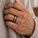 Lifestyle view of 8mm Black & Rose Tungsten Band with Imitation Meteorite Inlay worn on hand