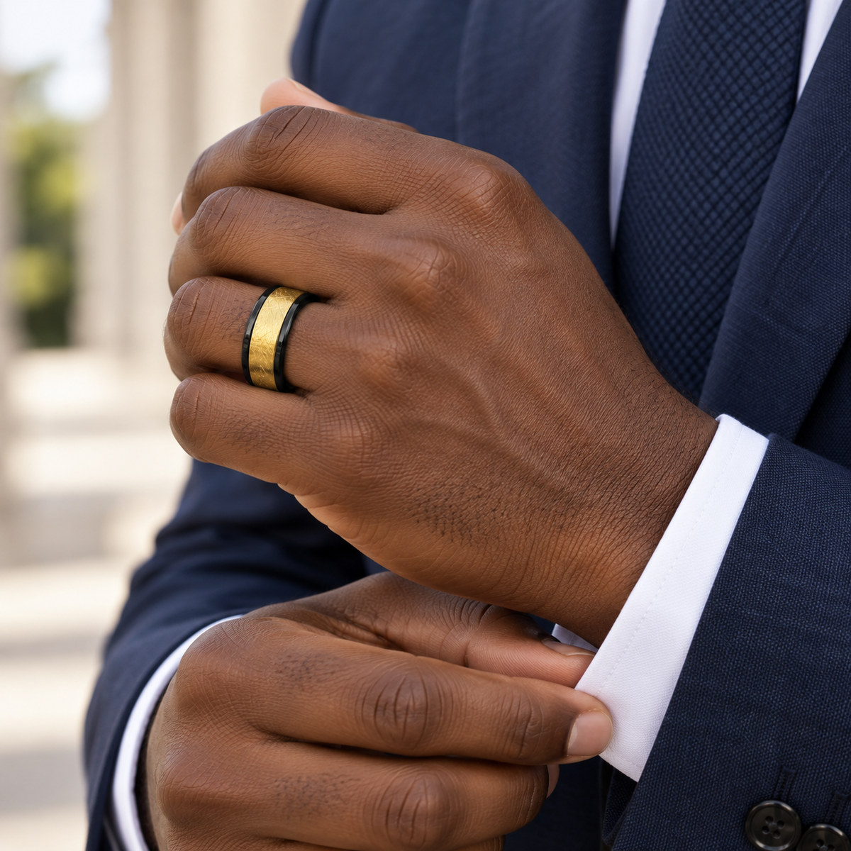Lifestyle view of 8mm Black & Yellow Tungsten Wire-Brushed Band worn on hand
