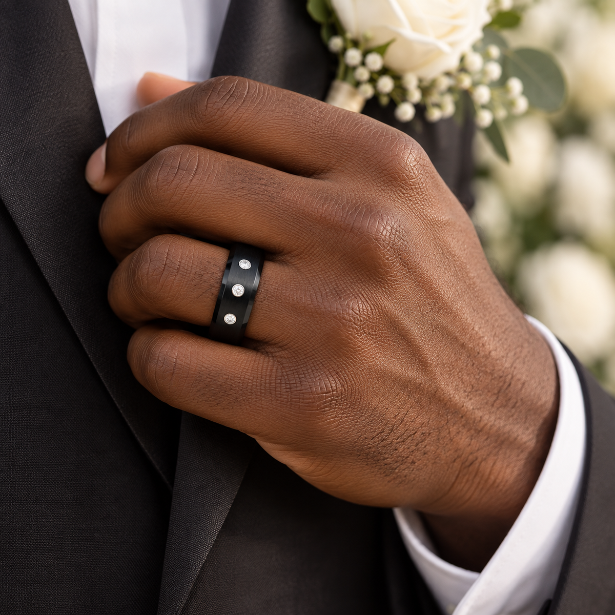 Lifestyle view of 8mm Black Tungsten Band with 3 White Diamonds worn on hand