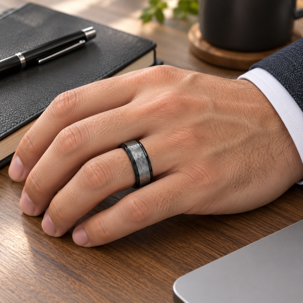 Lifestyle view of 8mm Black Tungsten Band with Hammered Gray Center worn on hand