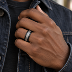 Lifestyle view of 8mm Black Tungsten Band with Imitation Meteorite Inlay worn on hand
