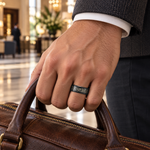 Lifestyle view of 8mm Black Tungsten Celtic Cut-Out Inlay Band worn on hand