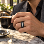 Lifestyle view of 8mm Black Tungsten Hammered Band with Gray Center Stripe worn on hand