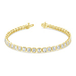 A gold-colored bracelet featuring a series of emerald-cut stones, with metallic clasp fastenings at the ends.
