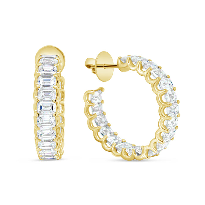 A pair of 18K gold emerald cut hoop earrings with diamonds set in them.
