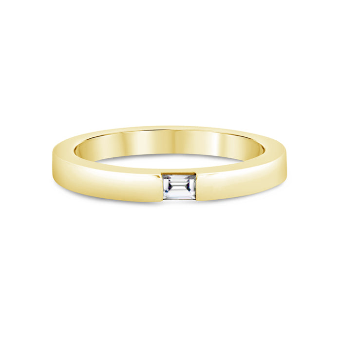 A single baguette cut diamond ring with a 14k gold metal band.