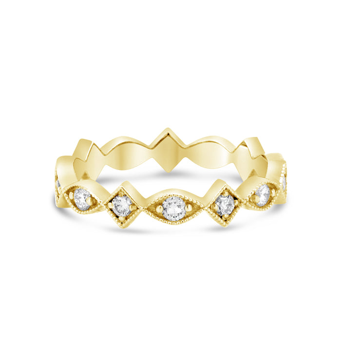 A gold eternity band with scalloped and square design, featuring diamond details.