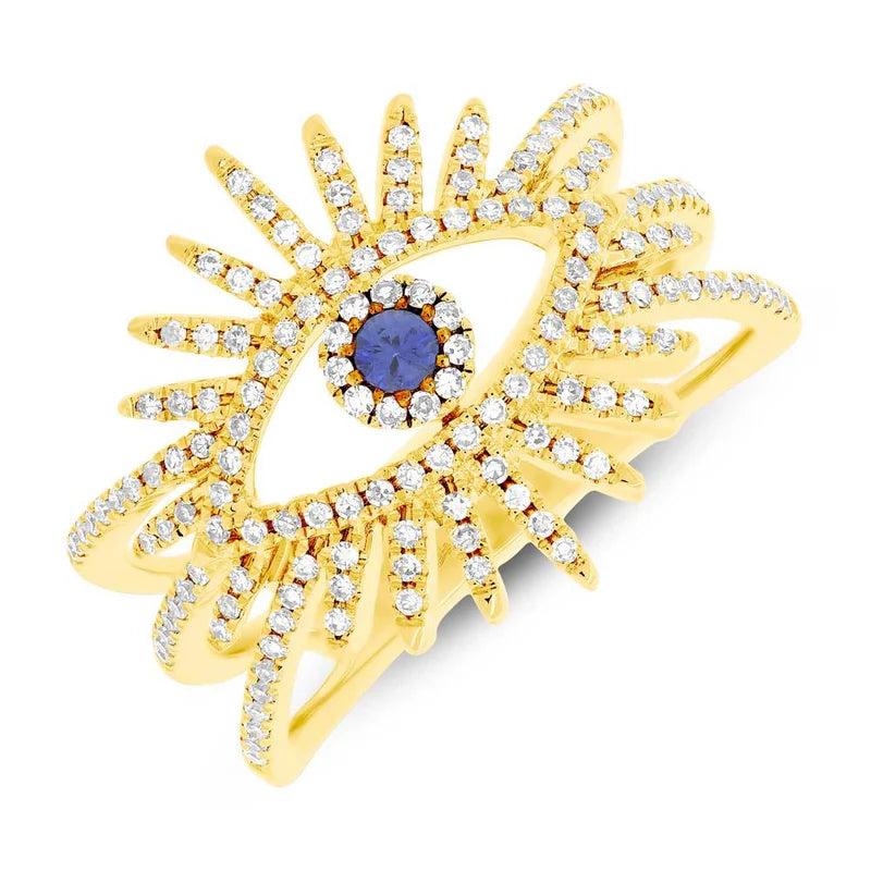 A gold ring featuring a central sapphire gemstone flanked by a border of round diamonds, with a sunburst design.