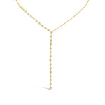 Gold necklace with small diamonds on a white background