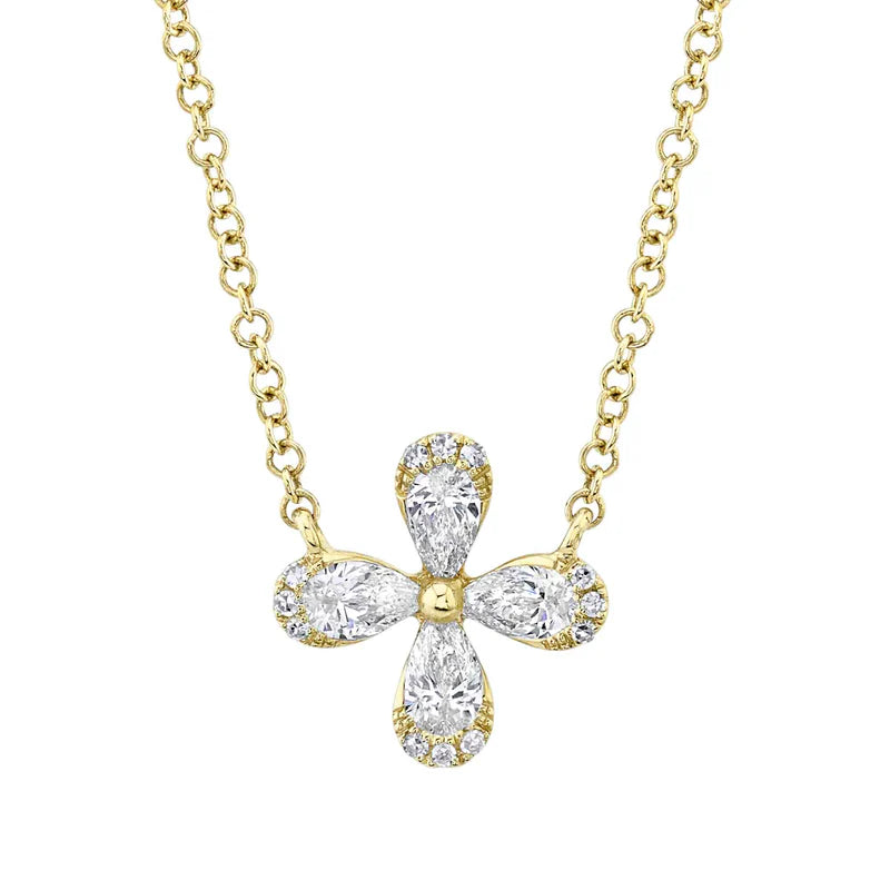 A gold-colored necklace featuring a pear-cut flower-shaped pendant adorned with diamonds.