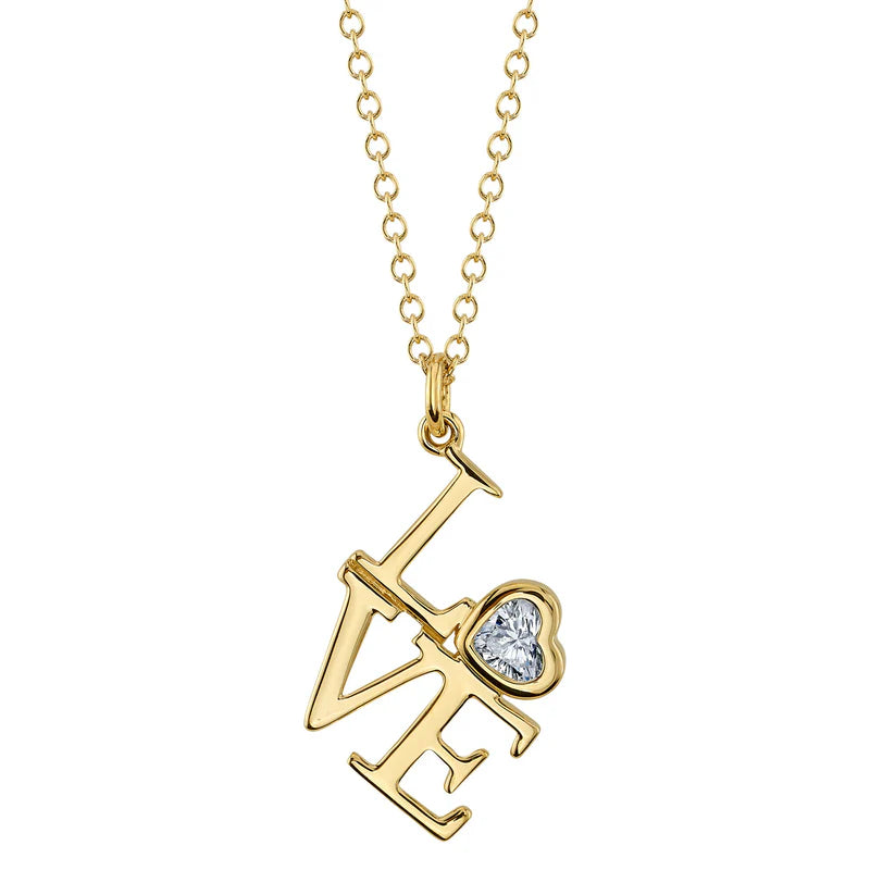 A gold pendant in the shape of a heart with a diamond in the center, attached to a gold chain.