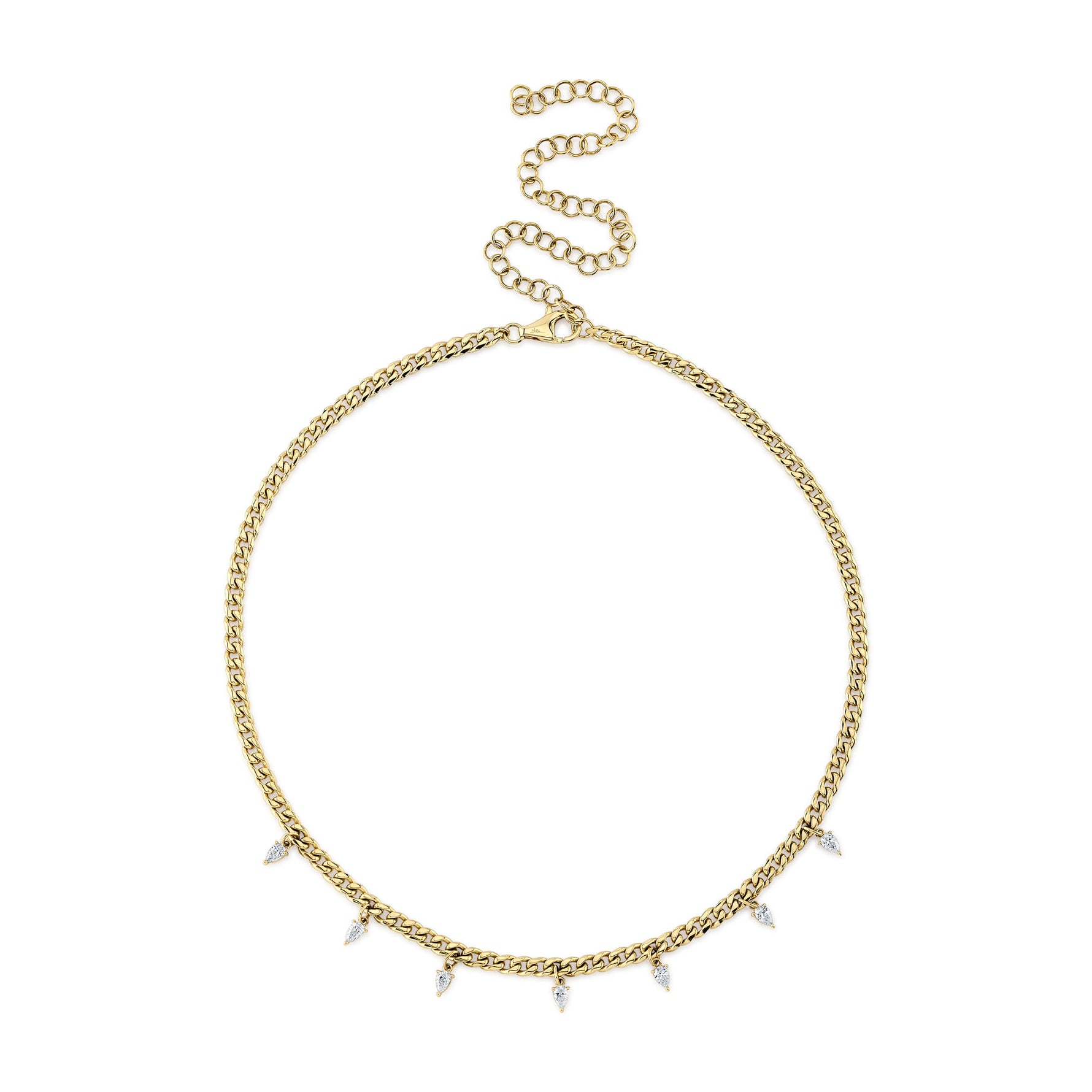 A gold-colored necklace with pear shape diamond accents on a chain.