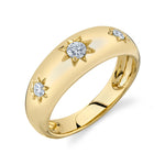 A gold signet ring with three diamond accents on the top surface.
