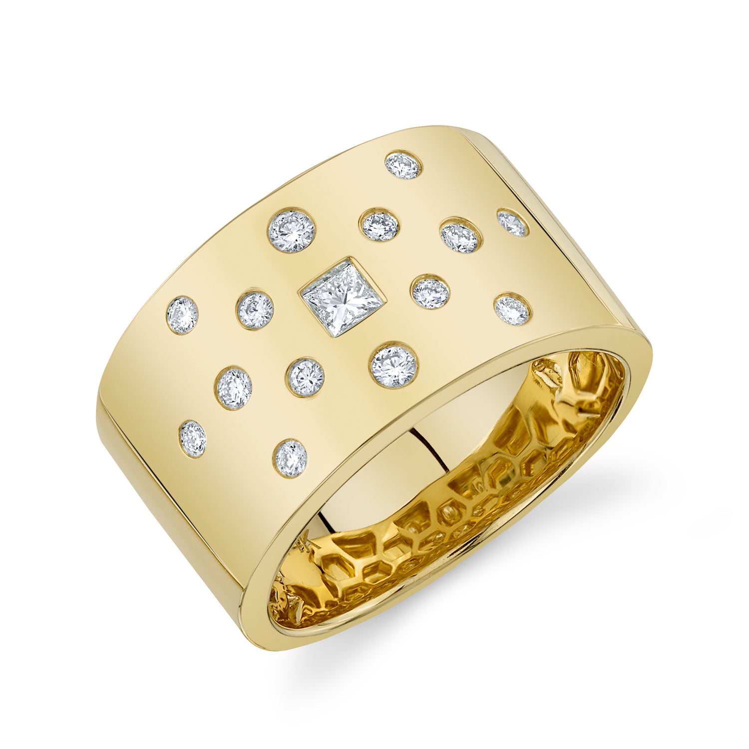 A 14k gold cigar band ring with bezel-set diamonds.