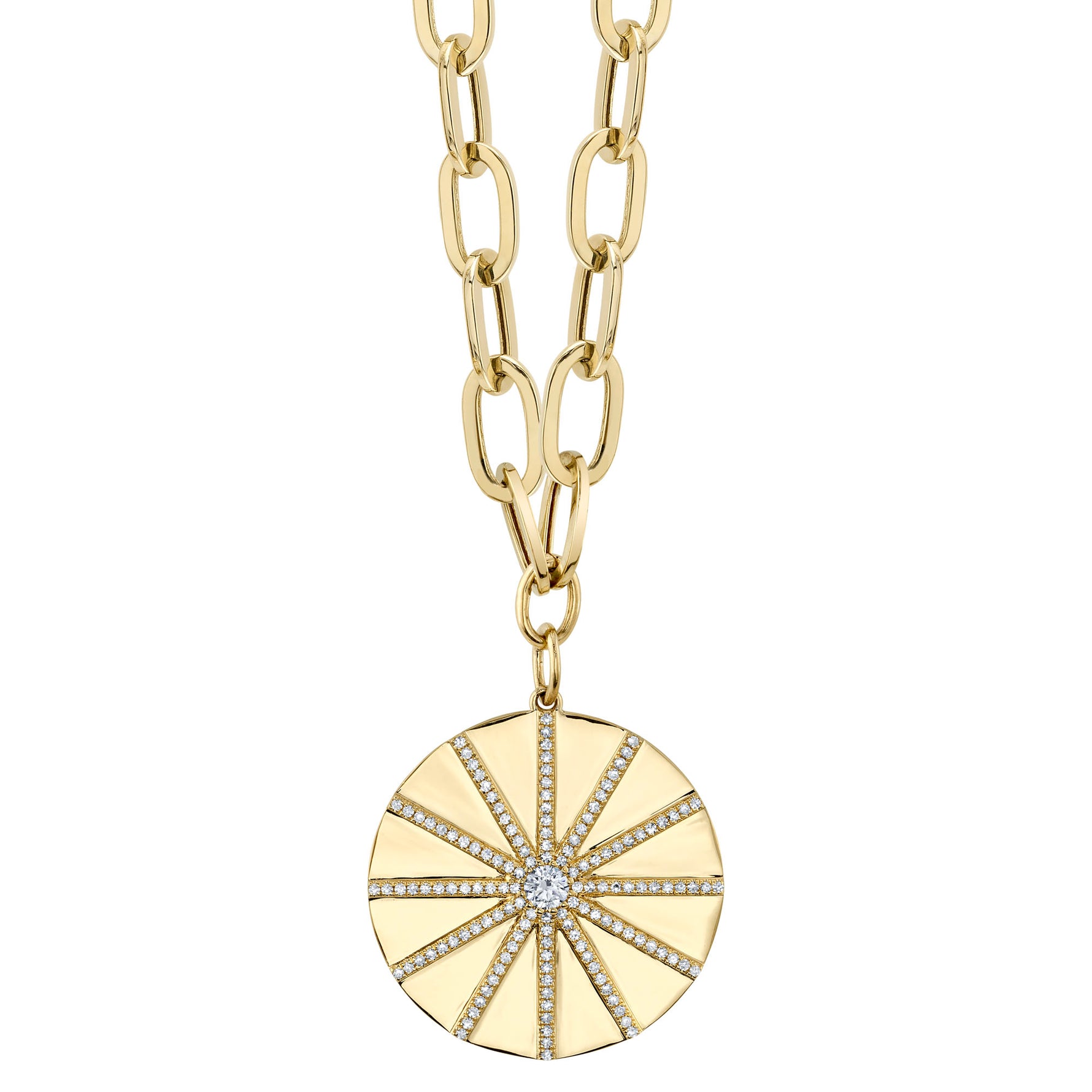 A gold-colored necklace with a paper clip chain design and a round pendant featuring a sun and star motif adorned with diamonds.