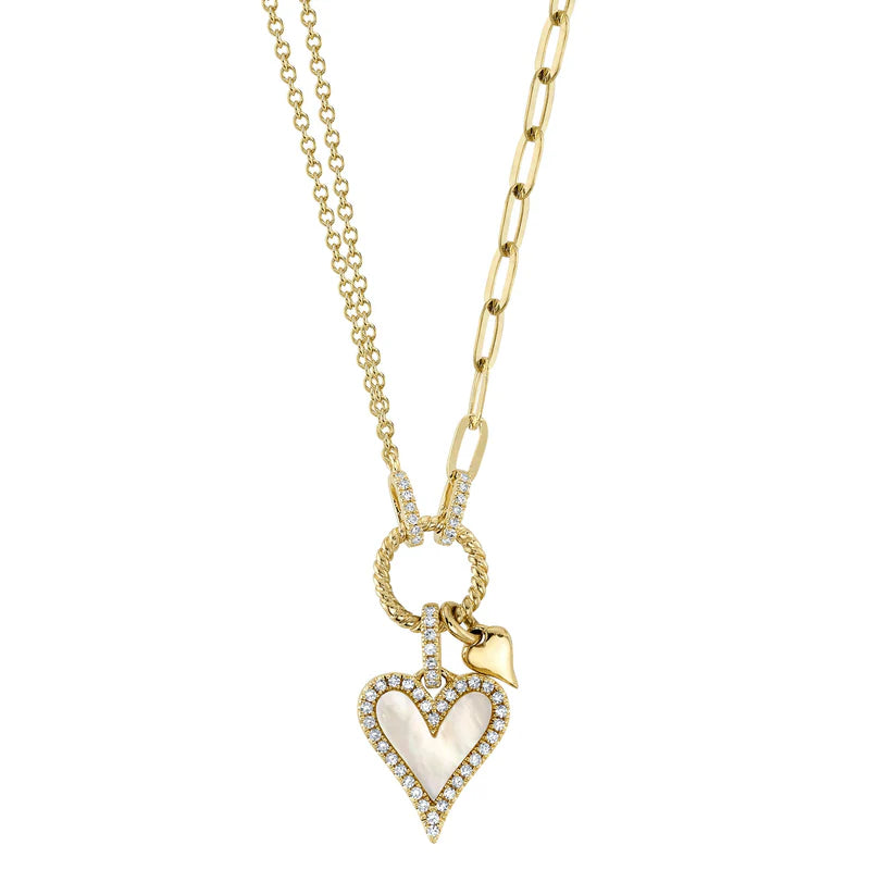 A 14K gold necklace with a mother of pearl heart-shaped clip and a small diamond detail.