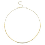A gold-colored diamond bezel set necklace with a length of 18 inches, featuring a series of round bezel-set diamonds.