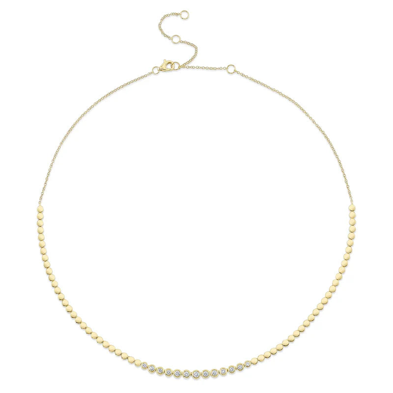 A gold-colored diamond bezel set necklace with a length of 18 inches, featuring a series of round bezel-set diamonds.