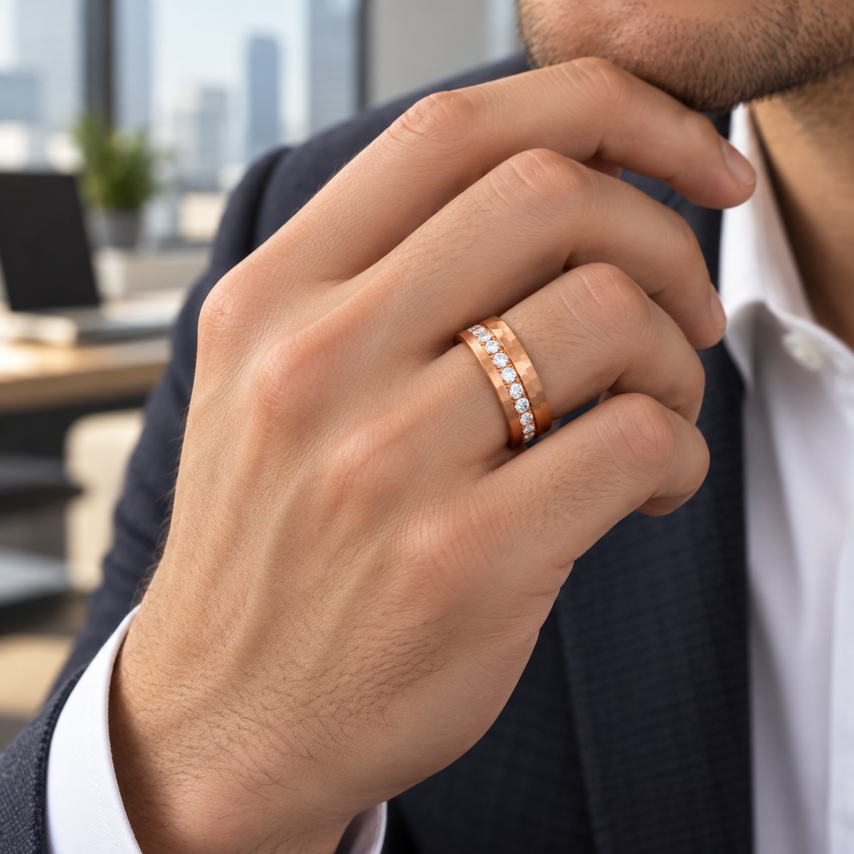8mm rose tungsten band with diamond channel worn on hand in lifestyle setting