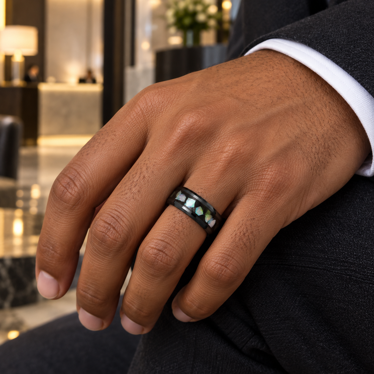 8mm black tungsten band with abalone inlay worn on hand in lifestyle setting