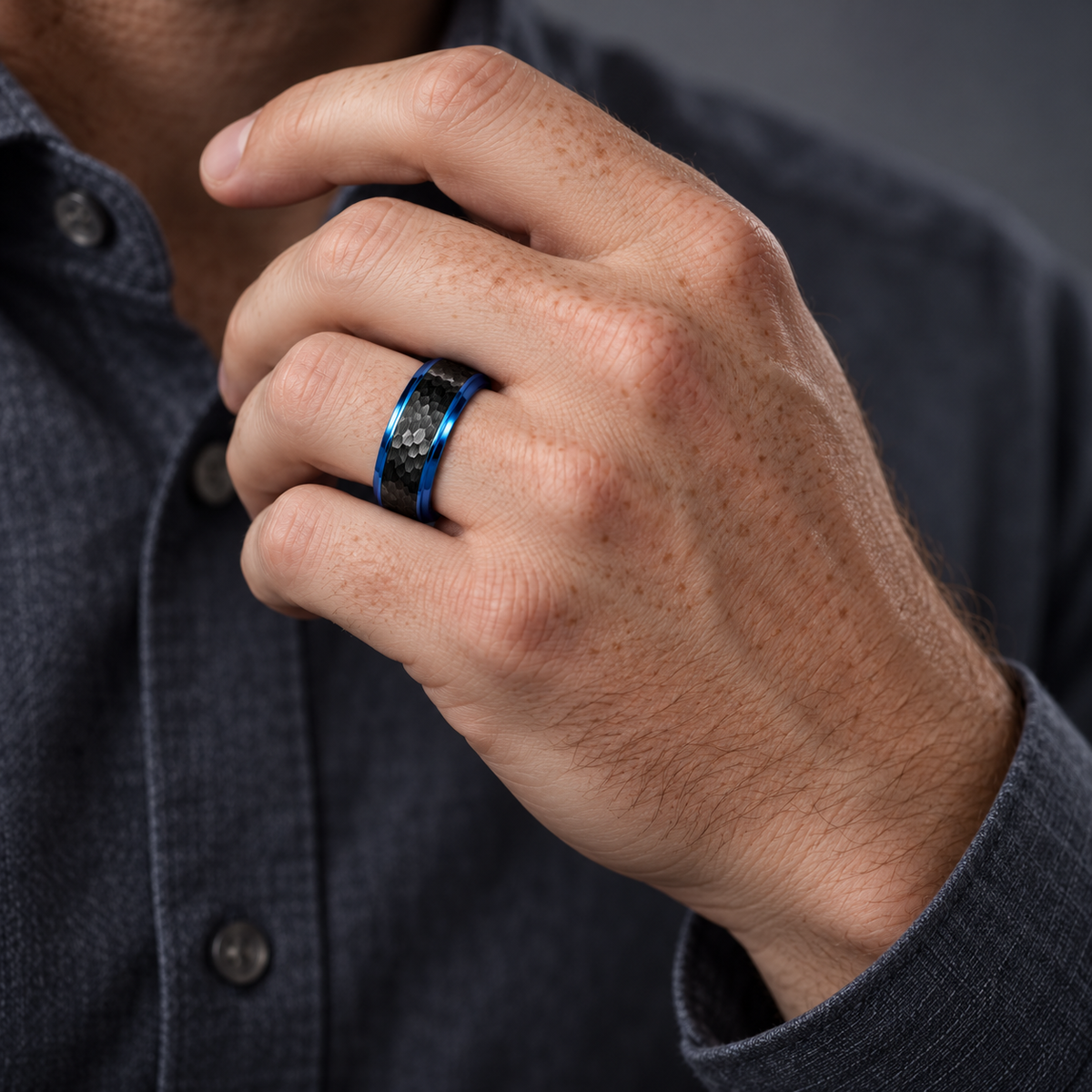 6mm Black & Blue Tungsten Honeycomb Band worn on hand lifestyle view