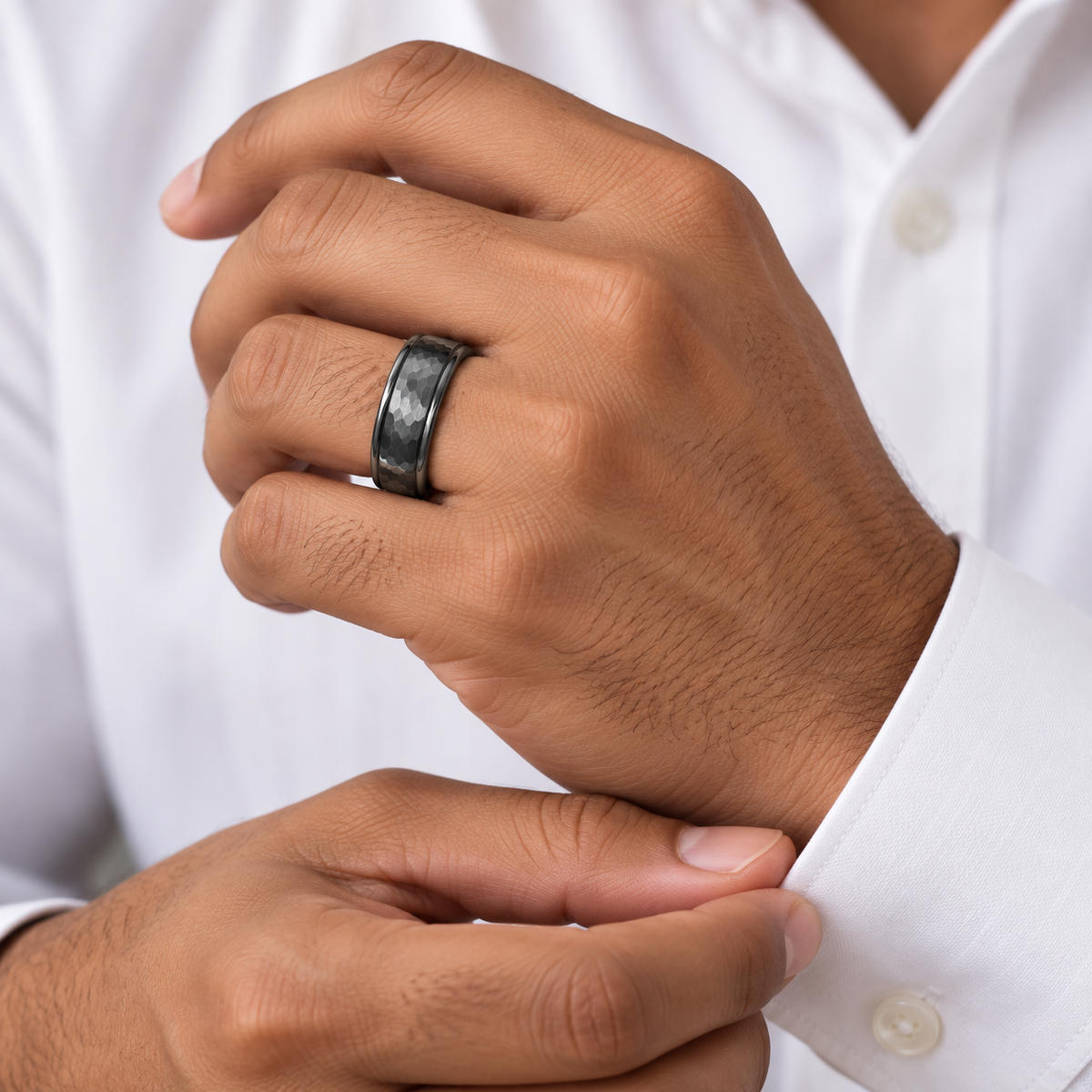 8mm Gunmetal Tungsten Hammered Beveled-Edge Band worn on hand lifestyle view — TR972